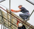 Male workers mounting solar panel system outdoors. Royalty Free Stock Photo