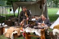 Two men selling armour, helmets and swords at the re-enactment of the Battle of Hastings in the UK