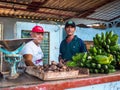 Two men selling manioc and bananas in cuba