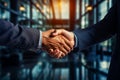 Two men shaking hands in front of glass wall in office building. Generative AI Royalty Free Stock Photo