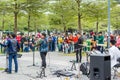 Two men of Shenzhen local street band palying guitar and singing at the Central park of Shenhzhen