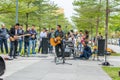 Two men of Shenzhen local street band palying guitar and singing at the Central park of Shenhzhen