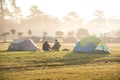 Two men sitting near camping tent