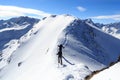 Two men snowshoe hiking on mountain snow arete and panorama in Stubai Alps Royalty Free Stock Photo