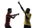 Two men soccer player and referee showing red card silhouette Royalty Free Stock Photo