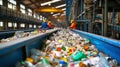 Two Men Sorting Plastic Bottles at Garbage Processing Plant Royalty Free Stock Photo