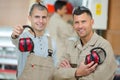 Two men standing in carpentry workshop Royalty Free Stock Photo
