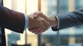 two men in suits shaking hands close shot