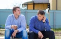 Two men taking a break for coffee Royalty Free Stock Photo