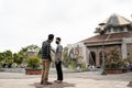 two men talking in the courtyard of the Gadjah Mada University mosque