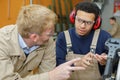 two men talking in workshop Royalty Free Stock Photo