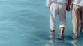 Two men walking in blue water, holding hands. Male couple on summer holidays, enjoying tropical turquoise sea. Generative AI Royalty Free Stock Photo