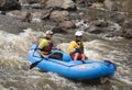 Two men whitewater rafting on the popular Poudre River in Colorado on the Poudre River, Colorado, USA, 8 May Royalty Free Stock Photo