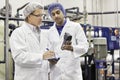 Two men working in bottling factory Royalty Free Stock Photo