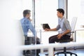 Two men working in a modern office Royalty Free Stock Photo