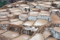 Two men working at salt ponds in Maras, Cuzco, Sacred Valley