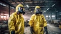 Two men in yellow protective suits standing in a factory