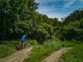 Two mens at edge of hill ride downhill in park Royalty Free Stock Photo