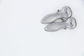 Two metal cloth clips on white background