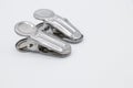Two metal cloth clips on white background
