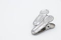 Two metal cloth clips on white background