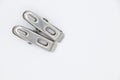 Two metal cloth clips on white background