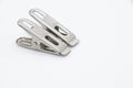 Two metal cloth clips on white background