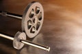 Two metal cogged wheels on steel background Royalty Free Stock Photo