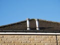 Two metal roof chimneys on roof Royalty Free Stock Photo