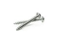 Two metal screws isolated on background Royalty Free Stock Photo