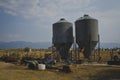 The two metal silo on the old rusty farm Royalty Free Stock Photo