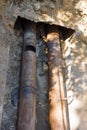 Two metal welded pipes lay togather in the ground