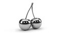 Two metallic cherries connected by a shared stem, featuring a polished, reflectiv Royalty Free Stock Photo