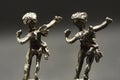 Two metallic dancing angels, dance with them