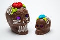 Two Mexican Calaverita de azucar Candy Skull and Calaverita de Chocolate,