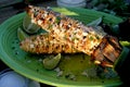 Two Mexican grilled street corn on the cobs close up