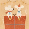 two mice sit on a box with a gift drink tea coffee on a holiday new year christmas concept