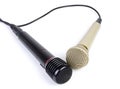 Two microphones with a cord isolated on a white Royalty Free Stock Photo