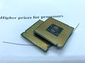 Two microprocessors on a paper written higher prices closeup view Royalty Free Stock Photo