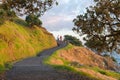 Two middle-aged women walking on track around Mount Maunganui in morning light Royalty Free Stock Photo