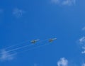 Two military aircraft flying in the blue sky Royalty Free Stock Photo