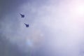 Two military fighters fly in the sky. Royalty Free Stock Photo