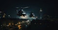 Two military helicopters cross the outskirts of the city at night at low altitude