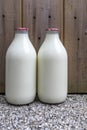 Two Milk Bottles on a Doorstep Royalty Free Stock Photo