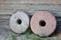 Two millstones on old wooden wall background Royalty Free Stock Photo