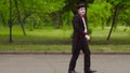 Two funny mimes play jokes in the park