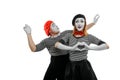 Two mimes on white background. Mime actress with excited face