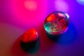 Two mineral gems colorfully illuminated showing abstract details