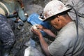 Two miners looking for silver in the silver mine of the Cerro Rico in Potosi, Bolivia. Royalty Free Stock Photo