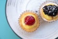 Mini fruit italian cupcakes with fresh berries on board Royalty Free Stock Photo